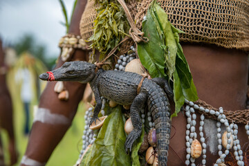 Crocodile festival in Ambunti, Sepik area in Papua New Guinea with crocodils and mask.