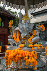 Silver Ganesha with offerings outside Wat Sri Suphan, know as Silver Temple in Chiang Mai