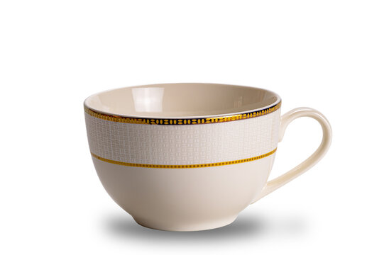 Empty brown ceramic coffee cup with golden pattern decorated edge isolated on white background with clipping path in side view closeup horizontal format.