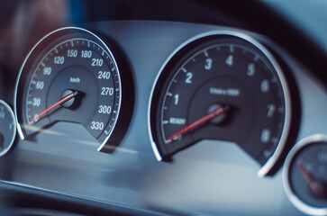 Fototapeta premium Car dashboard analog gauges display. Close up shot, selective focus, no people