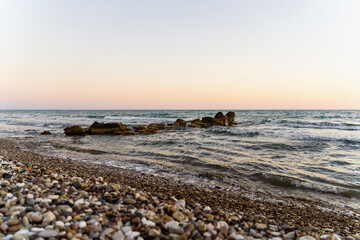 Stones in sea on Kourion beach in Episkopi, Cyprus