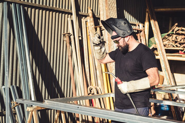Man welder working in metal unt aller