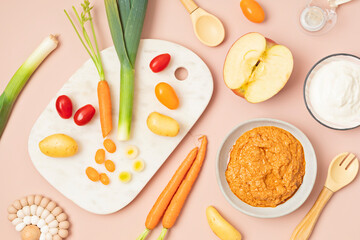 Baby puree made of fresh vegetables and fruits. First baby solid food recipe idea. Top view,  flat lay