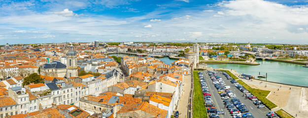 Rooftops and Old Port of La Rochelle on a sunny day - obrazy, fototapety, plakaty