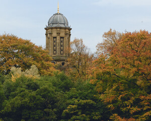 The decorated tower of Saltaire's United Reformed Church stands out against the skyline and early autumn colours