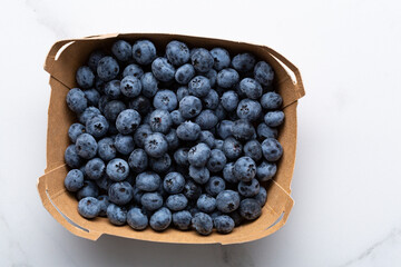 Top view of paper box with fresh blueberry food