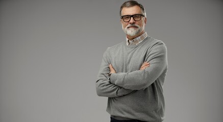 Portrait of happy casual mature man smiling, senior age man with gray hair, Isolated on gray...