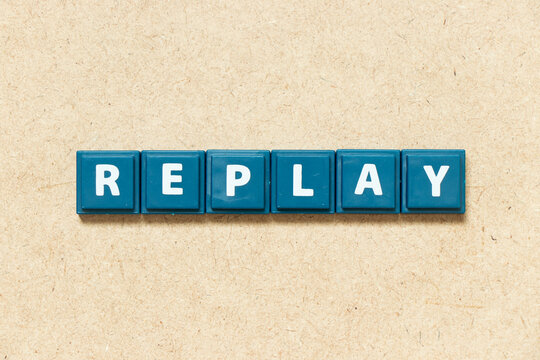 Tile alphabet letter in word replay on wood background