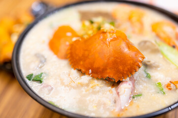 Seafood crab congee rice bowl in restaurant