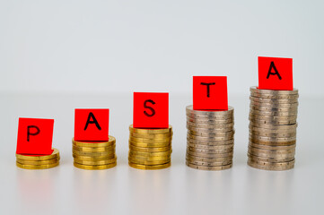 Piles of coins, and above tickets that spell the word 