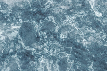 Clear pool water,  Closeup beautiful ripple water surface in pool for background.  Abstract background