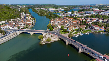 Aerial view of the confluence between the Seine and the Yonne showing different colors of water mixing in the town of Montereau Fault Yonne in Seine et Marne, France - obrazy, fototapety, plakaty