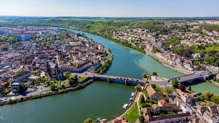 Aerial view of the confluence between the Seine and the Yonne showing different colors of water mixing in the town of Montereau Fault Yonne in Seine et Marne, France - obrazy, fototapety, plakaty