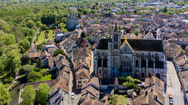 Aerial view of the medieval town of Moret-sur-Loing in Seine et Marne, France - Our Lady of the Nativity gothic church next to the old dungeon tower