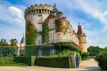 Castle of Rambouillet near Paris, Yvelines, France - Old stately home that was the official residence of the Presidents of the French Republic with round turrets covered with vines - obrazy, fototapety, plakaty