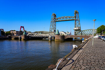 Koningshavenbrug ("King's Haven Bridge") is an industrial-style railway bridge across the Nieuwe Maas in Rotterdam, the Netherlands. The central part of this bridge is raised thanks to a pulley system
