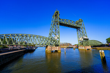 Koningshavenbrug ("King's Haven Bridge") is an industrial-style railway bridge across the Nieuwe Maas in Rotterdam, the Netherlands. The central part of this bridge is raised thanks to a pulley system