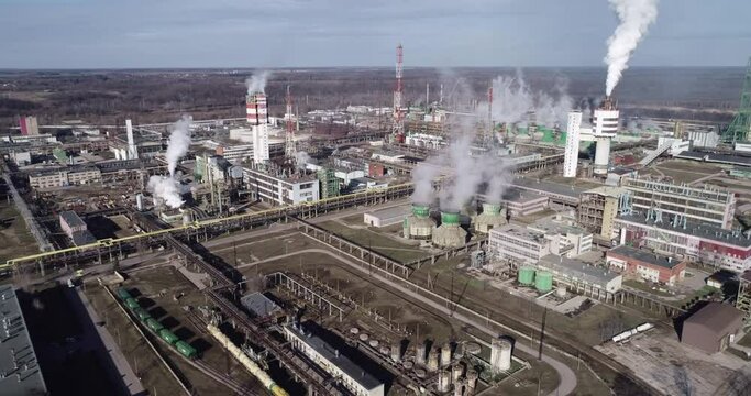 Chemistry Factory in Lithuania, Achema in Jonava City. Clear Blue Sky and Smoke Stacks in Background. Drone