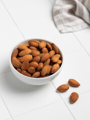 Almond nuts on a light background.