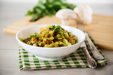 cabbage early fried with mushrooms, carrots and vegetables