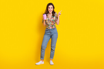 Full body photo of young woman wear shirt hold her favorite espresso coffee point finger favorite cafeteria isolated on yellow background
