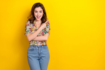 Photo of shiny excited woman dressed vintage flower print open mouth pointing finger empty space...