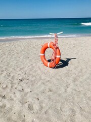 Lifebuoy on the beach. Sand. Sea. Sky. Horizon. Coastal safety.