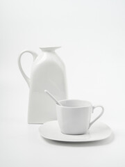 Modern summer still life. a white vase with long shadows.white background of the wall table. Empty space for copying. An elegant lifestyle in the Mediterranean style.