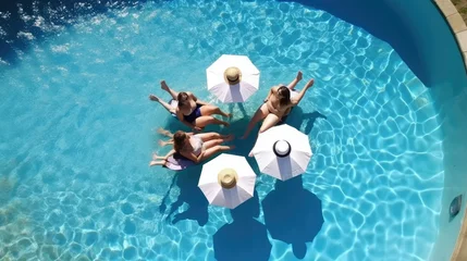 Keuken spatwand met foto Aerial view of friends relaxing at a sunny summer poolside © Oliver