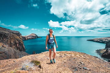 Sporty woman walks along beautiful foothills of Madeira Island. São Lourenço, Madeira Island, Portugal, Europe.