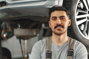 Portrait of a male mechanic in an auto repair shop