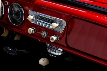 Dashboard of a stylish classic passenger car. The excellent restoration of the vehicle with nice...