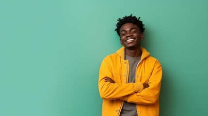 Portrait of a happy African American teenage boy isolated on a bright background