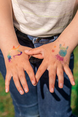 Shimmering sparkling glitter tattoo on a child's hand at a birthday party