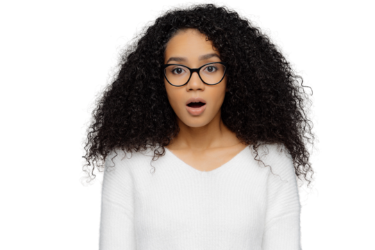 Shocked woman with frizzy hair and glasses, isolated on white background, surprised and stunned - Powered by Adobe