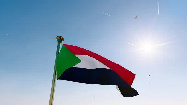 ULTRA HD. Flag of SUDAN waving in the wind, sky and sun background. Sudan Flag Video. 4K
