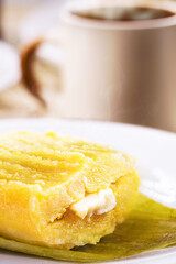 Typical Brazilian sweet pamonha made with corn and stuffed with cheese, served hot. Traditional food from Minas Gerais state , rural sweet of the June festivities