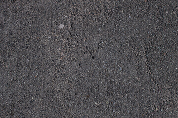 asphalt. damaged asphalt. asphalt with small stones.