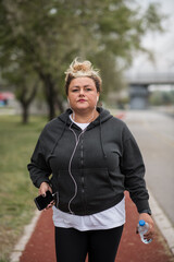 Fat woman tired after workout