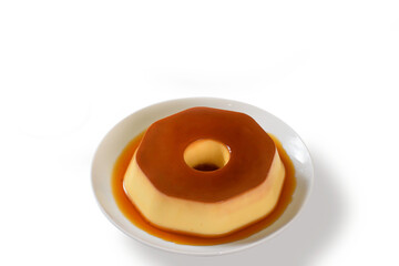 A plate of flan with caramel sauce on it 