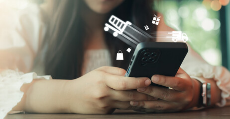 Woman using mobile phone with online shopping concept, virtual shopping cart trolley, Online shopping concept. Marketplace website, Online shopping business.