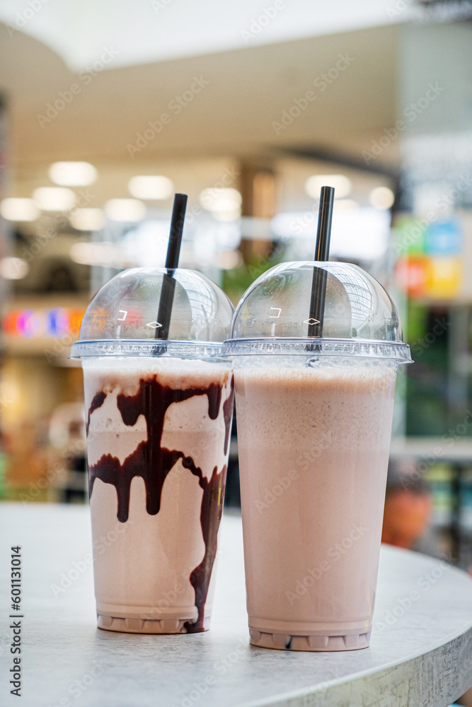 Sticker milk cocktails in plastic cups