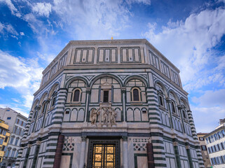 The Florence Baptistery in Italy. The Baptistery  of Saint John is one of the oldest buildings in Florence constructed in the Florentine Romanesque style. - obrazy, fototapety, plakaty