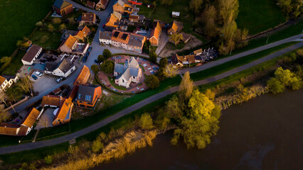 Aerial view of a Church in Vlassenbroek, a tiny village on the shore of the Scheldt river