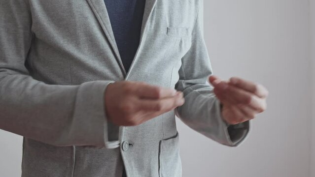 Gesture Hands snapping fingers performed by a man in a stylish jacket. Melody playing. Beating the rhythm