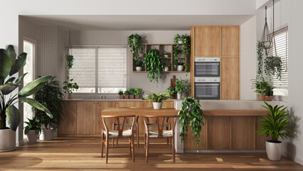 Urban jungle interior design, wooden kitchen in white and beige tones with many houseplants. Island...