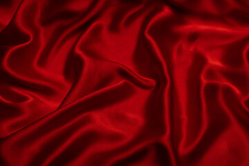 Red silk or satin luxury fabric texture can use as abstract background.