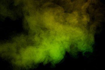 Fototapeta na wymiar Yellow and green steam on a black background.