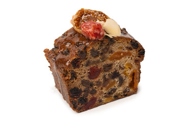 A cake with dried fruits, raisins almonds, dried strawberry.