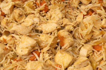 Tasty pilaf with chicken as background.